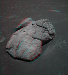 This anaglyph from NASA's Mars Exploration Rover Opportunity shows an unusual, lumpy rock informally named 'Wopmay' on the lower slopes of 'Endurance Crater.' 3D glasses are necessary to view this image.