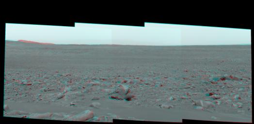 This stereo view is from NASA's Mars Exploration Rover Spirit as it was investigating a rock called 'Mazatzal' on the rim of 'Bonneville Crater.' 3D glasses are necessary to view this image.