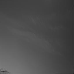 Clouds above the rim of 'Endurance Crater' in this image from NASA's Mars Exploration Rover Opportunity can remind the viewer that Mars, our celestial neighbor, is subject to weather. On Earth, clouds like these would be referred to as cirrus clouds.