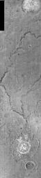 This night time image released on Nov 23, 2004 from NASA's 2001 Mars Odyssey shows a small fluvial channel located near Tinto Vallis, one of the larger volcanic complexs in the southern hemisphere of Mars. These channels are northeast of Tyrrhena Patera.