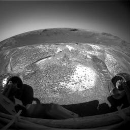 NASA's Mars Exploration Rover Opportunity climbed out of 'Endurance Crater' on Dec. 12, 2004 and used its front hazard-avoidance camera to look back across the crater from the rim.