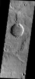 This image from NASA's Mars Odyssey shows a large crater on Mars, older than all the smaller craters around it from the region near Naktong Vallis. The crater no longer has any visible rim or ejecta, and is simply a circular smooth floored basin. 