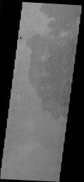 This image from NASA's Mars Odyssey was taken in the Tartarus region of Mars. These flows illustrate a platy lava surface. This surface type develops when the top of a lava flows cools and then is broken into pieces by continued movement of the flow.