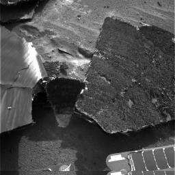 NASA's Mars Exploration Rover Opportunity used its navigation camera for this view of the flank piece of the spacecraft's heat shield on the rover's 332nd martian day, or sol (Dec. 29, 2004).