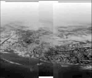 This composite was produced from images returned, January 14, 2005, by the ESA's Huygens probe during its descent to land on Titan showing the boundary between the lighter-colored uplifted terrain, marked with drainage channels, and darker lower areas.