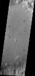 This image from NASA's Mars Odyssey shows a landslide located inside an impact crater located south of the Isidis Planitia region of Mars, formed due to slope failure of the inner crater rim.