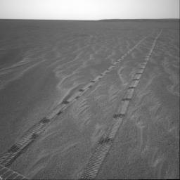 NASA's Mars Exploration Rover Opportunity looked at its tracks on martian soil as it left the home it has known for over 200 sols. The rover spent 181 sols inside 'Endurance Crater,' furthering our knowledge of ancient water on Mars.