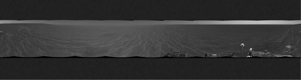 On Dec. 18, 2004, NASA's Mars Exploration Rover Opportunity was on its way from 'Endurance Crater' toward the spacecraft's jettisoned heat shield when the navigation camera took the images combined into this 360-degree panorama.