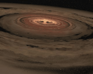 This artist's concept shows a brown dwarf surrounded by a swirling disc of planet-building dust. NASA's Spitzer Space Telescope spotted such a disc around a surprisingly low-mass brown dwarf, or 'failed star.'