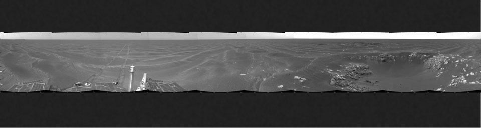 NASA's Mars Exploration Rover Opportunity took this view of its surroundings on Feb. 24, 2005. Opportunity had reached the eastern edge of a small crater dubbed 'Naturaliste,' seen in the right foreground.