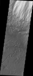 This image taken by NASA's Mars Odyssey shows chaos on Candor Chasma on Mars. Chaos is typically interpreted to be a collapse terrain; it is the blocky landscape after the transport and removal of subsurface support.