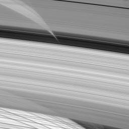 This close-up image from NASA's Cassini spacecraft peers directly through regions of the A, B and C rings (from top to bottom here) to glimpse shadows of the very same rings cast upon the planet's atmosphere.