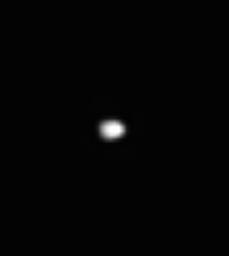 The blob of light seen here is Saturn's moon Telesto, which shares its orbital path with the much larger moon Tethys. This image was taken in visible green light with NASA's Cassini spacecraft's narrow-angle camera on Aug. 1, 2005.