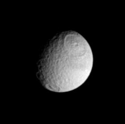 NASA's Cassini spacecraft offers up this nice view of the craters Odysseus (at the top) and Melanthius (at the bottom) on Saturn's moon Tethys.