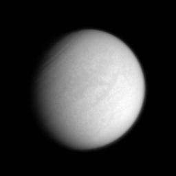The 'H'-shaped region Fensal-Aztlan is faintly visible on Saturn's murky moon Titan in this enhanced clear-filter view from NASA's Cassini spacecraft.