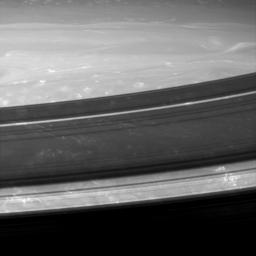 A gorgeous close-up from NASA's Cassini spacecraft at the Saturnian atmosphere reveals small, bright and puffy clouds with long filamentary streamers that are reminiscent of the anvil-shaped Earthly cirrus clouds that extend downwind of thunderstorms.