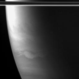 An oval-shaped feature, wider than Earth and with streamers extending out to the east and west, swirls in Saturn's southern hemisphere. This image was taken in wavelengths of polarized infrared light with NASA's Cassini spacecraft's wide-angle camera.