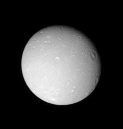 The leading hemisphere of Saturn's moon Dione displays linear grooves and subtle streaks in this image taken with NASA's Cassini spacecraft's narrow-angle camera on Dec. 24, 2005.