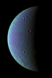 This view from NASA's Cassini spacecraft taken on Dec. 24, 2005, highlights tectonic faults and craters on Dione, an icy world that has undoubtedly experienced geologic activity since its formation.