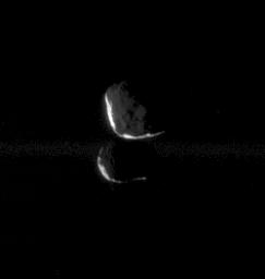 This close pairing of Janus and Epimetheus shows the two moons at 'high phase,' meaning that only a thin sliver of sunlit terrain is visible on each moon. This image was taken in visible light with NASA's Cassini spacecraft's narrow-angle camera.