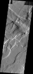 This image taken by NASA's Mars Odyssey shows the region east of Alba Patera on Mars featuring the complex relations that can occur in regions of multiple structural events. There are fractures and graben in this area that intersect at multiple angles.