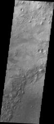 This image from NASA's Mars Odyssey spacecraft is of a small dune field inside an unnamed crater south of Nili Fossae on Mars.