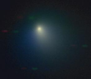 he Kitt Peak National Observatory's 2.1-meter telescope observed comet Tempel 1 on April 11, 2005, when the comet was near its closest approach to the Earth. A pinkish dust jet is visible to the southwest, with the broader neutral gas coma surrounding it.