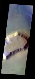 This false-color image from NASA's Mars Odyssey spacecraft shows a mesa and surrounding debris apron located in the Deuteronilus Mensae region, taken during Mars' southern fall season.