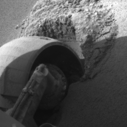 The left front wheel of NASA's Mars Exploration Rover Opportunity made slow but steady progress through soft dune material in this image taken by the rover's front hazard identification camera over a period of several days.