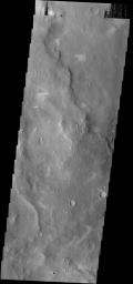 The windstreaks in this area northwest of Schiaparelli Crater on Mars point in three different directions. This indicates that the wind shifted with time as seen by NASA's 2001 Mars Odyssey.