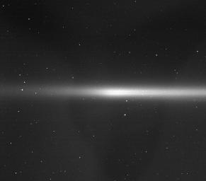 This view of the faint E ring - a ring feature now known to be created by Enceladus - also shows two of Saturn's small moons that orbit within the ring, among a field of stars in the background. This image was captured by NASA's Cassini spacecraft.