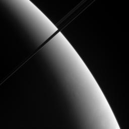 This oblique view of Saturn shows what may be localized upwellings in the clouds of Saturn's southern hemisphere. This view looks toward the unlit side of the rings as seen by NASA's Cassini spacecraft.