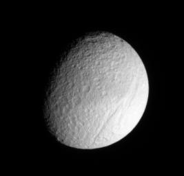 Ithaca Chasma rips across the cratered surface of Tethys, creating a scar more than 1,000 kilometers (600 miles) long, from north to south. NASA's Cassini spacecraft got a closer look at this ancient rift during a Sept. 2005 flyby of Tethys.