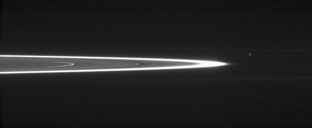 Tiny, dust-sized particles in Saturn's rings become much easier to see at high phase angle -- the angle formed by the Sun, the rings and the spacecraft. The brightest ring is the F ring as seen by NASA's Cassini spacecraft.