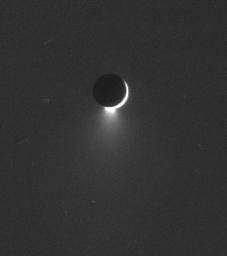 Enceladus continues to exhale water ice into Saturn orbit, keeping the E ring topped off with tiny particles as seen in this image from NASA's Cassini spacecraft.