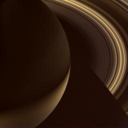 Saturn's fine, innermost rings are seen silhouetted against the southern hemisphere of the planet before partially disappearing into shadow as seen by NASA's Cassini spacecraft.