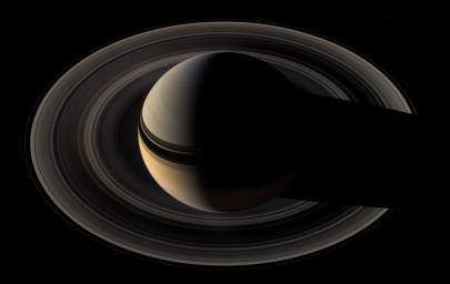 Saturn sits nested in its rings of ice NASA's Cassini spacecraft once again plunges toward the graceful giant.