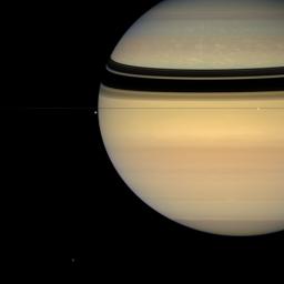 This colorful view, taken from edge-on with the ringplane by NASA's Cassini oribter on July 24, 2007, contains four of Saturn's attendant moons, brilliant Enceladus, irregular Hyperion, Epimetheus below the rings and between Tethys and Enceladus.