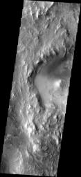 The erosion of the western rim of Hellas Basin on Mars has exposed a surface composed of layered material as seen by NASA's 2001 Mars Odyssey.