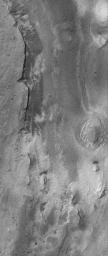 NASA's Mars Global Surveyor shows layered, light-toned exposures of probable sedimentary rock in Iani Chaos on Mars.