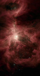 This image from NASA's Spitzer Space Telescope shows the Orion nebula, our closest massive star-making factory, 1,450 light-years from Earth. The nebula is close enough to appear to the naked eye as a fuzzy star in the sword of the constellation.