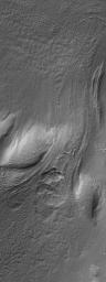 This image from NASA's Mars Global Surveyor shows a flow or landslide feature on a hillslope facing north (toward top/upper right) that is buried on both ends.
