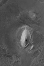 This image from NASA's Mars Global Surveyor shows a flow knob of light-toned, layered rock exposed by erosion in the Iani Chaos region of Mars.