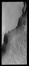 The unusual surface pattern exists at the margin of the north polar layered deposit on Mars as seen by NASA's Mars Odyssey spacecraft.