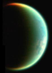 This composite image, composed of two images taken with NASA's Cassini visual and infrared mapping spectrometer, shows a crescent view of Saturn's moon Titan.