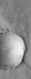 This image from NASA's Mars Global Surveyor shows an impact crater that is approximately 3.5 kilometers (2.2 miles) in diameter. Layered rock units are visible on the inside of the raised crater rim.