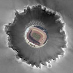 This photo composite shows an aerial view of FedEx Field in Landover, Md., home of the Washington Redskins, superimposed on Mars' Victoria Crater to give a sense of the crater's scale.