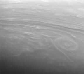 Weather whirls on an alien world. Bright clouds swim in giant banks and shoals in Saturn's dreamlike atmosphere. This image was taken with NASA's Cassini spacecraft's narrow-angle camera.
