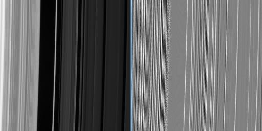 An extreme enhancement of the original image, presented at right, reveals the grainy region with greater clarity as seen by NASA's Cassini spacecraft.