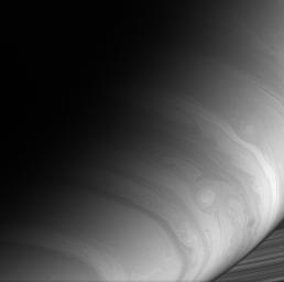 NASA's Cassini spacecraft captures the ripples, loops and storms that swirl in Saturn's east-west flowing cloud bands.
